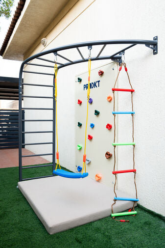 Outdoor corner monkey bar with climbing wall